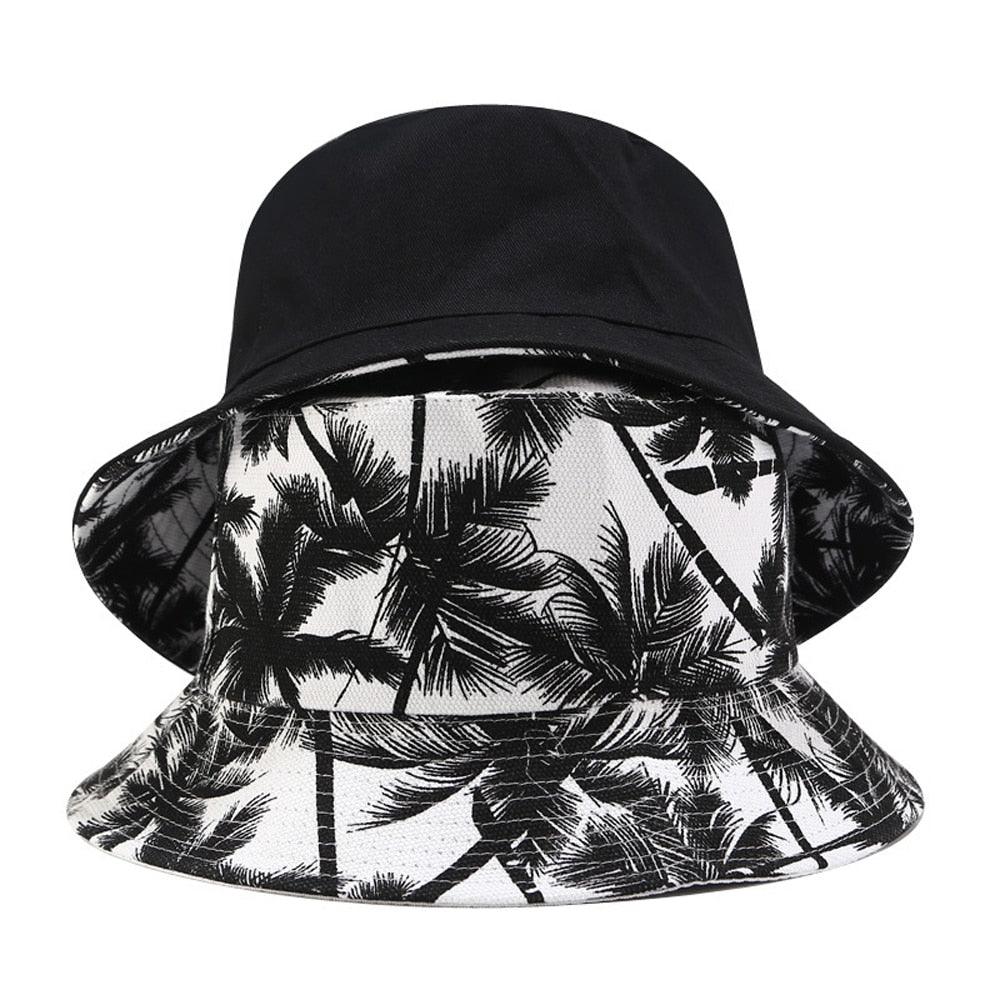 Black and white hat with palm trees on it.
