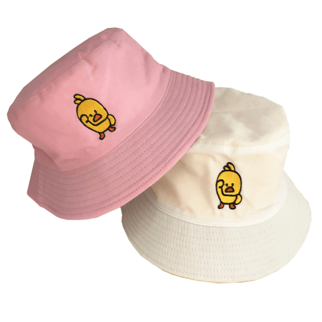 Pink and white bucket hats with yellow duck on the front
